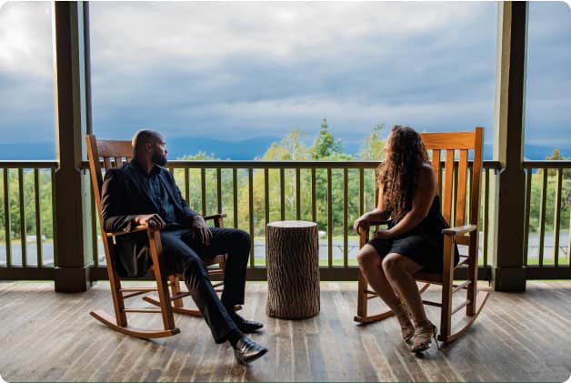 Two Guests in Rocking Chairs Enjoying the Views at Our Hudson Valley Hotel